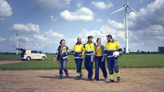 Join us Fluvius employees with a Fluvius van in the background